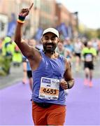 30 October 2022; Anish Augustine celebrates finishing the 2022 Irish Life Dublin Marathon. 25,000 runners took to the Fitzwilliam Square start line to participate in the 41st running of the Dublin Marathon after a two-year absence. Photo by Sam Barnes/Sportsfile
