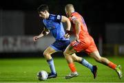 11 November 2022; Dara Keane of UCD in action against Niall O'Keeffe of Waterford during the SSE Airtricity League Promotion / Relegation Play-off match between UCD and Waterford at Richmond Park in Dublin. Photo by Seb Daly/Sportsfile