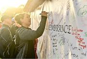 13 November 2022; Runners write on the Wall of Remembrance during the Remembrance Run 5K Supported by Silver Stream Healthcare at Phoenix Park in Dublin. Photo by Sam Barnes/Sportsfile