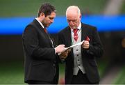13 November 2022; Derry City manager Ruaidhrí Higgins signs his team-sheet with kitman Georgie Hegarty, right, before the Extra.ie FAI Cup Final match between Derry City and Shelbourne at Aviva Stadium in Dublin. Photo by Stephen McCarthy/Sportsfile