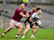 13 November 2022; Ceilum Docherty of Kilcoo in action against Dessie Ward of Ballybay Pearses during the AIB Ulster GAA Football Senior Club Championship Quarter-Final match between Kilcoo and Ballybay Pearse Brothers at St Tiernach's Park in Clones, Monaghan. Photo by Brendan Moran/Sportsfile