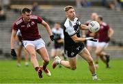 13 November 2022; Jerome Johnston of Kilcoo in action against Michael Hannon of Ballybay Pearses during the AIB Ulster GAA Football Senior Club Championship Quarter-Final match between Kilcoo and Ballybay Pearse Brothers at St Tiernach's Park in Clones, Monaghan. Photo by Brendan Moran/Sportsfile