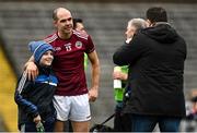 13 November 2022; Paul Finlay of Ballybay Pearses poses for a photo with a young supporter after the AIB Ulster GAA Football Senior Club Championship Quarter-Final match between Kilcoo and Ballybay Pearse Brothers at St Tiernach's Park in Clones, Monaghan. Photo by Brendan Moran/Sportsfile