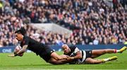 13 November 2022; Bailyn Sullivan of All Blacks XV scores his side's fifth try despite the tackle of Teddy Thomas of Barbarians during the Killik Cup match between Barbarians and All Blacks XV at Tottenham Hotspur Stadium in London, England. Photo by Ramsey Cardy/Sportsfile