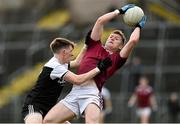 13 November 2022; Colm Lennon of Ballybay Pearses catches the ball ahead of Micéal Rooney of Kilcoo during the AIB Ulster GAA Football Senior Club Championship Quarter-Final match between Kilcoo and Ballybay Pearse Brothers at St Tiernach's Park in Clones, Monaghan. Photo by Brendan Moran/Sportsfile