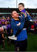 13 November 2022; Kilmacud Crokes manager Donal McGovern celebrates with his son Seán, aged 6, after his side's victory in the AIB Leinster GAA Hurling Senior Club Championship Quarter-Final match between Kilmacud Crokes and Clough/Ballacolla at Parnell Park in Dublin. Photo by Sam Barnes/Sportsfile