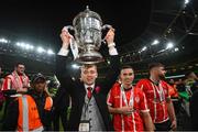 13 November 2022; Injured Derry City player Ciaron Harkin celebrates with the FAI Senior Challenge Cup after the Extra.ie FAI Cup Final match between Derry City and Shelbourne at Aviva Stadium in Dublin. Photo by Stephen McCarthy/Sportsfile