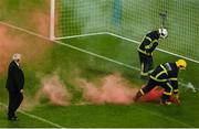 13 November 2022; Members of Dublin Fire Brigade remove flares from the pitch during the Extra.ie FAI Cup Final match between Derry City and Shelbourne at Aviva Stadium in Dublin. Photo by Michael P Ryan/Sportsfile