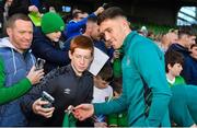 14 November 2022; Dara O'Shea with supporters after a Republic of Ireland training session at the Aviva Stadium in Dublin. Photo by Seb Daly/Sportsfile