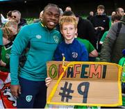 14 November 2022; Michael Obafemi with a supporter after a Republic of Ireland training session at the Aviva Stadium in Dublin. Photo by Seb Daly/Sportsfile