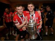 13 November 2022; Cameron McJannet, left, and Ronan Boyce of Derry City celebrate with the FAI Senior Challenge Cup after the Extra.ie FAI Cup Final match between Derry City and Shelbourne at Aviva Stadium in Dublin. Photo by Stephen McCarthy/Sportsfile