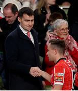 13 November 2022; Jack Chambers TD, Minister of State for Sport and the Gaeltacht, shakes hands with Joe Thomson of Derry City after the Extra.ie FAI Cup Final match between Derry City and Shelbourne at Aviva Stadium in Dublin. Photo by Stephen McCarthy/Sportsfile