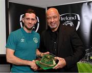14 November 2022; Alan Browne is presented with his 2021-2022 Republic of Ireland international cap by former Republic of Ireland player Paul McGrath during a presentation at their team hotel in Dublin. Photo by Seb Daly/Sportsfile