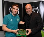 14 November 2022; Seamus Coleman is presented with his 2021-2022 Republic of Ireland international cap by former Republic of Ireland player Paul McGrath during a presentation at their team hotel in Dublin. Photo by Seb Daly/Sportsfile