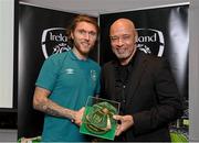 14 November 2022; Jeff Hendrick is presented with his 2021-2022 Republic of Ireland international cap by former Republic of Ireland player Paul McGrath during a presentation at their team hotel in Dublin. Photo by Seb Daly/Sportsfile