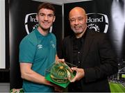 14 November 2022; Darragh Lenihan is presented with his 2021-2022 Republic of Ireland international cap by former Republic of Ireland player Paul McGrath during a presentation at their team hotel in Dublin. Photo by Seb Daly/Sportsfile