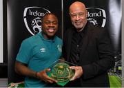 14 November 2022; Michael Obafemi is presented with his 2021-2022 Republic of Ireland international cap by former Republic of Ireland player Paul McGrath during a presentation at their team hotel in Dublin. Photo by Seb Daly/Sportsfile