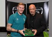 14 November 2022; James McClean is presented with his 2021-2022 Republic of Ireland international cap by former Republic of Ireland player Paul McGrath during a presentation at their team hotel in Dublin. Photo by Seb Daly/Sportsfile