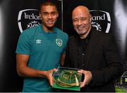 14 November 2022; Gavin Bazunu is presented with his 2021-2022 Republic of Ireland international cap by former Republic of Ireland player Paul McGrath during a presentation at their team hotel in Dublin. Photo by Seb Daly/Sportsfile