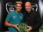 14 November 2022; Callum Robinson is presented with his 2021-2022 Republic of Ireland international cap by former Republic of Ireland player Paul McGrath during a presentation at their team hotel in Dublin. Photo by Seb Daly/Sportsfile