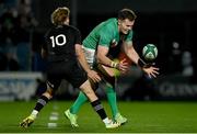 4 November 2022; Jacob Stockdale of Ireland is tackled by Damian McKenzie of All Blacks during the match between Ireland A and All Blacks XV at RDS Arena in Dublin. Photo by Brendan Moran/Sportsfile