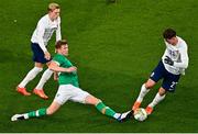 17 November 2022; Nathan Collins of Republic of Ireland in action against Marcus Holmgren Pedersen, left, and Jørgen Larsen of Norway during the International Friendly match between Republic of Ireland and Norway at the Aviva Stadium in Dublin. Photo by Ben McShane/Sportsfile
