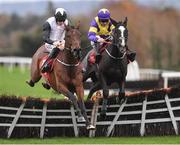 19 November 2022; Absolute Notions, left, with Jack Kennedy up, jump the last with second place Deep Cave with Davy Russell on their way to winning The O'Connor Heating & Plumbing Supporting Longford GAA Maiden Hurdle during day one of the Punchestown Festival at Punchestown Racecourse in Kildare. Photo by Matt Browne/Sportsfile