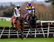 19 November 2022; Absolute Notions, left, with Jack Kennedy up, jump the last with second place Deep Cave with Davy Russell on their way to winning The O'Connor Heating & Plumbing Supporting Longford GAA Maiden Hurdle during day one of the Punchestown Festival at Punchestown Racecourse in Kildare. Photo by Matt Browne/Sportsfile