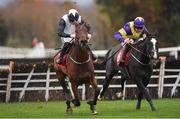 19 November 2022; Absolute Notions, left, with Jack Kennedy up, on their way to winning The O'Connor Heating & Plumbing Supporting Longford GAA Maiden Hurdle from second place Deep Cave with Davy Russell during day one of the Punchestown Festival at Punchestown Racecourse in Kildare. Photo by Matt Browne/Sportsfile