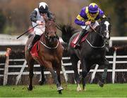 19 November 2022; Absolute Notions, left, with Jack Kennedy up, on their way to winning The O'Connor Heating & Plumbing Supporting Longford GAA Maiden Hurdle from second place Deep Cave with Davy Russell during day one of the Punchestown Festival at Punchestown Racecourse in Kildare. Photo by Matt Browne/Sportsfile