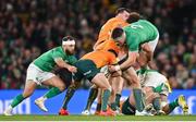 19 November 2022; Nic White of Australia is tackled by Jamison Gibson Park, left, and Dan Sheehan of Ireland, 2, who is lifted by Mark Nawaqanitawase, during the Bank of Ireland Nations Series match between Ireland and Australia at the Aviva Stadium in Dublin.  Photo by Ramsey Cardy/Sportsfile