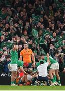 19 November 2022; Ireland players celebrate a try, scored by Bundee Aki, hidden, during the Bank of Ireland Nations Series match between Ireland and Australia at the Aviva Stadium in Dublin. Photo by Ramsey Cardy/Sportsfile