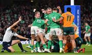 19 November 2022; Craig Casey, left, and Finlay Bealham of Ireland, celebrate their side's first try, scored by teammate Bundee Aki, hidden, during the Bank of Ireland Nations Series match between Ireland and Australia at the Aviva Stadium in Dublin. Photo by David Fitzgerald/Sportsfile