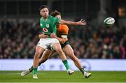 19 November 2022; Hugo Keenan of Ireland offloads as he is tackled by Mark Nawaqanitawase of Australia during the Bank of Ireland Nations Series match between Ireland and Australia at the Aviva Stadium in Dublin. Photo by Harry Murphy/Sportsfile