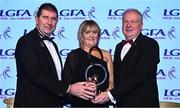 19 November 2022; Brenda McAnespie of Monaghan is presented with the her LGFA Hall of Fame award by President of the LGFA Mícheál Naughton, left, and Ard Stiúrthóir TG4 Alan Esslemont, during the TG4 All-Ireland Ladies Football All Stars Awards banquet, in association with Lidl, at the Bonnington Dublin Hotel. Photo by Eóin Noonan/Sportsfile