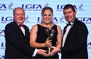 19 November 2022; Monica McGuirk of Meath is presented with her TG4 LGFA All Star award by Ard Stiúrthóir TG4 Alan Esslemont, left, and President of the LGFA Mícheál Naughton during the TG4 All-Ireland Ladies Football All Stars Awards banquet, in association with Lidl, at the Bonnington Dublin Hotel. Photo by Eóin Noonan/Sportsfile