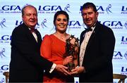 19 November 2022; Shauna Ennis of Meath is presented with her TG4 LGFA All Star award by Ard Stiúrthóir TG4 Alan Esslemont, left, and President of the LGFA Mícheál Naughton during the TG4 All-Ireland Ladies Football All Stars Awards banquet, in association with Lidl, at the Bonnington Dublin Hotel. Photo by Eóin Noonan/Sportsfile