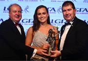 19 November 2022; Emma Duggan of Meath is presented with her TG4 LGFA All Star award by Ard Stiúrthóir TG4 Alan Esslemont, left, and President of the LGFA Mícheál Naughton during the TG4 All-Ireland Ladies Football All Stars Awards banquet, in association with Lidl, at the Bonnington Dublin Hotel. Photo by Eóin Noonan/Sportsfile
