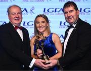 19 November 2022; Niamh McLaughlin of Donegal is presented with her TG4 LGFA All Star award by Ard Stiúrthóir TG4 Alan Esslemont, left, and President of the LGFA Mícheál Naughton during the TG4 All-Ireland Ladies Football All Stars Awards banquet, in association with Lidl, at the Bonnington Dublin Hotel. Photo by Eóin Noonan/Sportsfile