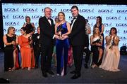 19 November 2022; TG4 Senior Players Player of the Year Niamh McLaughlin of Donegal is presented with her award by Ard Stiúrthóir TG4 Alan Esslemont, left, and President of the LGFA Mícheál Naughton during the TG4 All-Ireland Ladies Football All Stars Awards banquet, in association with Lidl, at the Bonnington Dublin Hotel. Photo by Eóin Noonan/Sportsfile