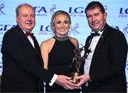 19 November 2022; Niamh Carmody of Kerry is presented with her TG4 LGFA All Star award by Ard Stiúrthóir TG4 Alan Esslemont, left, and President of the LGFA Mícheál Naughton during the TG4 All-Ireland Ladies Football All Stars Awards banquet, in association with Lidl, at the Bonnington Dublin Hotel. Photo by Eóin Noonan/Sportsfile