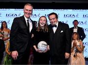 19 November 2022; MC Dáithí Ó Sé, left, and Marty Morrissey with Aoife Ramsbottom from Laois during the TG4 All-Ireland Ladies Football All Stars Awards banquet, in association with Lidl, at the Bonnington Dublin Hotel. Photo by Eóin Noonan/Sportsfile