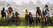 20 November 2022; A view of the field as they jump over Ruby's Double during The Pigsback.com Risk Of Thunder Steeplechase during day two of the Punchestown Festival at Punchestown Racecourse in Kildare. Photo by Matt Browne/Sportsfile