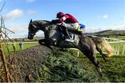 20 November 2022; Farceur Du Large, with Bryan Cooper up, jump the fourth on their way to winning The Ryans Cleaning Handicap Steeplechase during day two of the Punchestown Festival at Punchestown Racecourse in Kildare. Photo by Matt Browne/Sportsfile