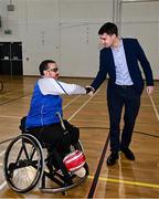 20 November 2022; Minister of State for Sport and the Gaeltacht, Jack Chambers TD meeting James McCarthy of Munster before the M.Donnelly GAA Wheelchair Hurling / Camogie All-Ireland Finals 2022 at Ashbourne Community School in Ashbourne, Meath. Photo by Eóin Noonan/Sportsfile