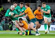 19 November 2022; Mack Hansen of Ireland is tackled by Bernard Foley and Andrew Kellaway of Australia during the Bank of Ireland Nations Series match between Ireland and Australia at the Aviva Stadium in Dublin. Photo by John Dickson/Sportsfile