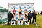 20 November 2022; Womens Senior 8000m medallists, from left, Ciara Mageean of City of Lisburn AC, Antrim, silver, Sarah Healy of U.C.D. AC, Dublin, gold, and Michelle Finn of Leevale AC, Cork, bronze, with CEO of RSA Ireland, a subsidiary of 123.ie, Kevin Thompson, left, Athletics Ireland president John Cronin and Athletics Ireland Chair of Competitions Andrew Lynam during the 123.ie Senior and Even Age Cross County Championships at Rosapenna Golf Course in Rosapenna, Donegal. Photo by Ben McShane/Sportsfile