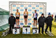20 November 2022; Womens U23 8000m medallists, from left, Danielle Donegan of U.C.D. AC, Dublin, silver, Sarah Healy of U.C.D. AC, Dublin, gold, and Laura Mooney of Tullamore Harriers AC, Offaly, bronze, with CEO of RSA Ireland, a subsidiary of 123.ie, Kevin Thompson, left, Athletics Ireland president John Cronin and Athletics Ireland Chair of Competitions Andrew Lynam during the 123.ie Senior and Even Age Cross County Championships at Rosapenna Golf Course in Rosapenna, Donegal. Photo by Ben McShane/Sportsfile