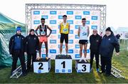 20 November 2022; Senior Mens 10,000m medallists, from left, Efrem Gidey of Clonliffe Harriers AC, Dublin, silver, Darragh McElhinney of U.C.D. AC, Dublin, gold, and Keelan Kilrehill of Moy Valley AC, Mayo, bronze, with, from left, Athletics Ireland Chair of Competitions Andrew Lynam, CEO of RSA Ireland, a subsidiary of 123.ie, Kevin Thompson, Olympian Danny McDaid and Athletics Ireland president John Cronin during the 123.ie Senior and Even Age Cross County Championships at Rosapenna Golf Course in Rosapenna, Donegal. Photo by Ben McShane/Sportsfile