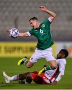 20 November 2022; Josh Cullen of Republic of Ireland is fouled by Joseph Essien Mbong of Malta during the International Friendly match between Malta and Republic of Ireland at the Ta' Qali National Stadium in Attard, Malta. Photo by Seb Daly/Sportsfile